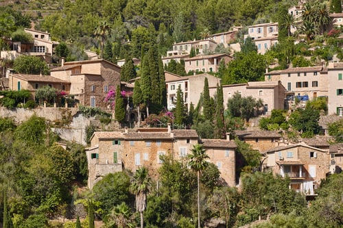 Preview: Traditional stone houses and tramuntana mountain range in Deia. Mallorca, Spain