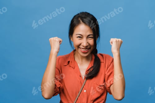 Preview: Excited Woman Celebrating Success on a Blue Background