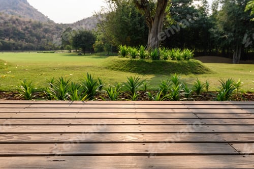 Preview: Wooden patio with garden on meadow background