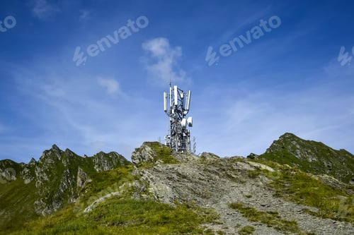 Preview: Metal tower with various telecommunication antennas on top of a mountain