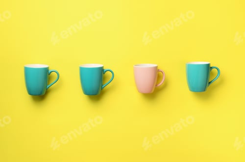 Preview: Pattern from blue and pink cups over yellow background. Birthday party celebration, baby shower