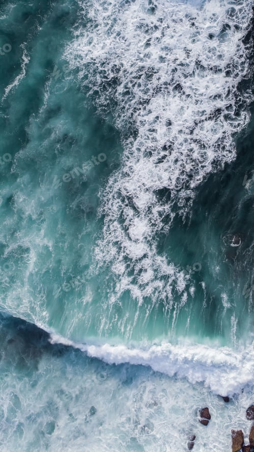 Preview: Vertical shot of beautiful sea waves moving towards the shore. Portugal.