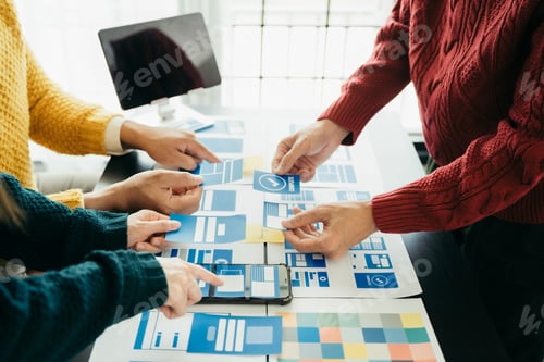 Preview: Creative team web designer planning application development.