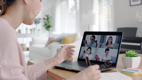 Preview: Back view of business woman talking about sale report in video conference