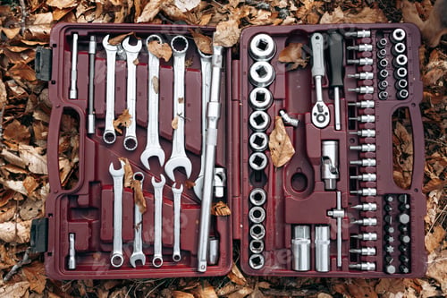 Preview: Set of wrenches in a box on forest ground
