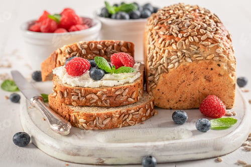 Preview: Sweet and homemade bread for breakfast with fruit and cheese.