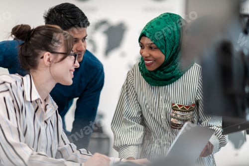 Preview: Multiethnic startup business team Arabian woman wearing a hijab on meeting in modern open plan