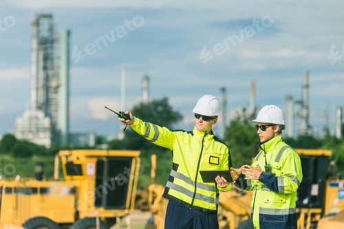 Preview: Professional engineer working outdoor, petroleum plant construction team survey