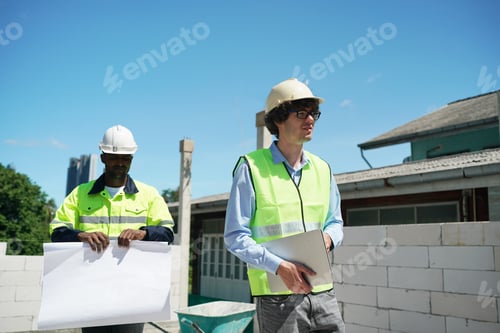 Preview: Architect and construction engineer or surveyor discussion plans and blueprints