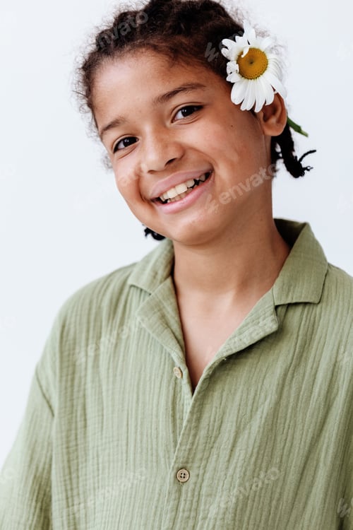 Preview: Young african american boy with daisy in his hair exudes trendy and playful vibes