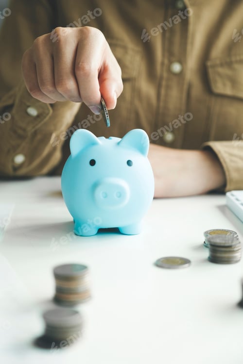 Preview: Saving Money with a Piggy Bank on Desk