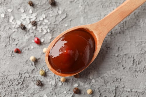 Preview: Spoon of delicious barbeque sauce, ingredients on grey background, space for text. Top view