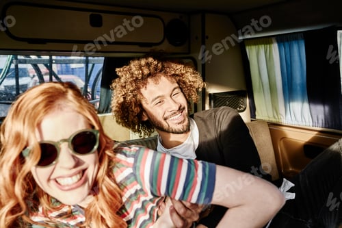 Preview: Happy young couple in a van