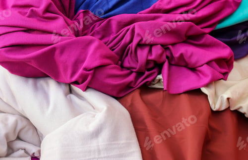 Preview: Closeup shot of surfaces and textures of folded fabrics cloth found at a fabrics market