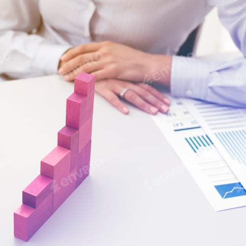Preview: Businesswoman building a growing financial chart