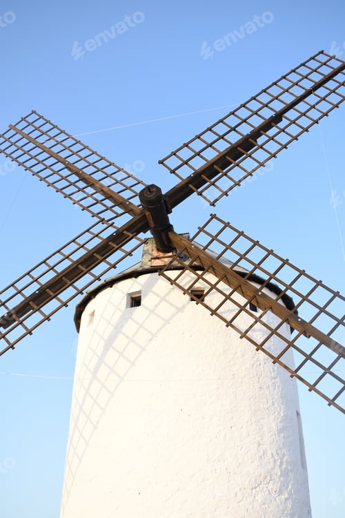 Preview: Vertical shot of a windmill against the blue sky