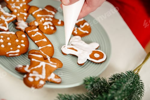 Preview: Kid decorating baked cookies with icing and confectionery mastic.