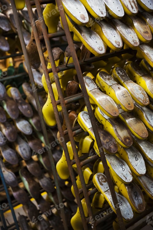 Preview: Close up of various metal shoe forms in a shoemaker's workshop.