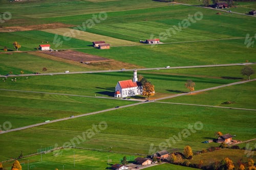 Preview: Aerial view of famous white St. Coloman pilgrimage church in autumn