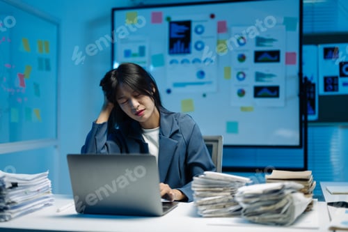 Preview: Tired businesswoman in an office, overwhelmed by paperwork, battles burnout and exhaustion as the de