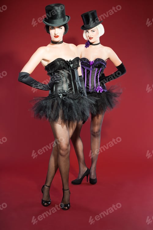 Preview: Two Burlesque Pin Up Women With Black Hair Dressed In Purple And Black. Sexy Pose. Wearing Black