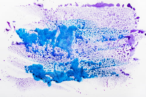 Preview: top view of blue and purple watercolor spills on white background
