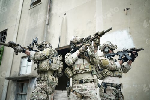 Preview: Soldier in full US MARSOC armed with assault rifle run through the abandoned building. Military