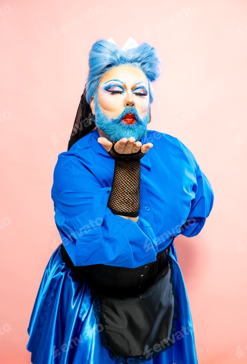 Preview: Crossdresser Man in Blue Shirt and Skirt Sending a Kiss