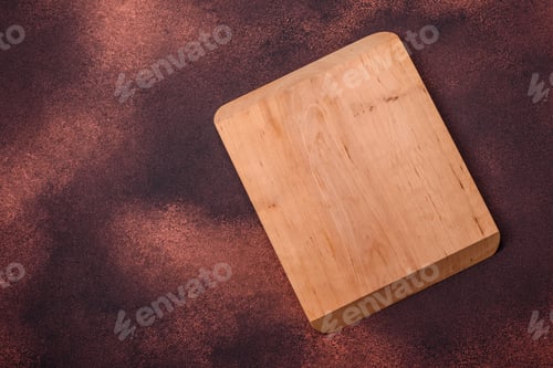 Preview: Empty rectangular wooden cutting board on textured concrete background