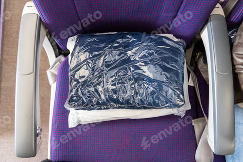 Preview: Sanitized and sealed wool blanket in plastic bag provided to passengers to keep warm and comfortable