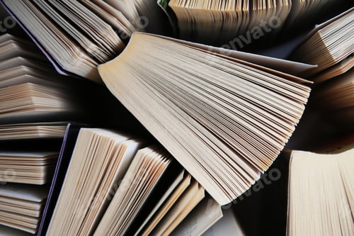 Preview: Collection of different books on white shelf, above view