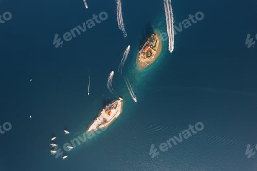 Preview: Motor boats sail around the islands of Gospa od Skrpjela and St. George. Montenegro. Top view