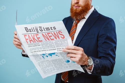Preview: cropped view of businessman reading newspaper with fake news, isolated on blue