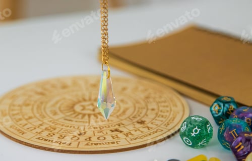Preview: Pendulum numerologist astrologer and zodiac signs. Selective focus.