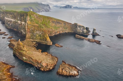 Preview: Mykines lighthouse and cliffs on Faroe islands from helicopter. Denmark