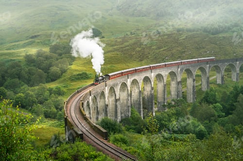 Preview: Train going over the Glenfinnan railway viaduct in Scotland, UK