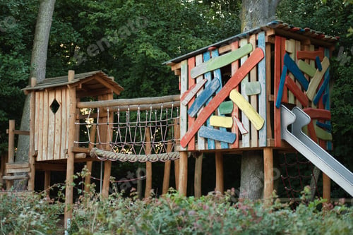 Preview: Climbing frame with a slide in a playground at a school