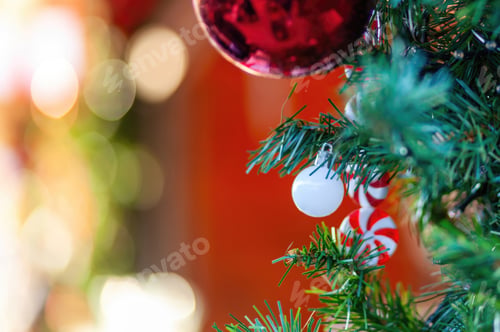 Preview: Christmas tree decorated with colorful balls and candy canes, creating festive atmosphere