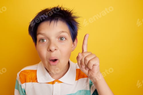 Preview: teen boy came up with an idea over isolated yellow background