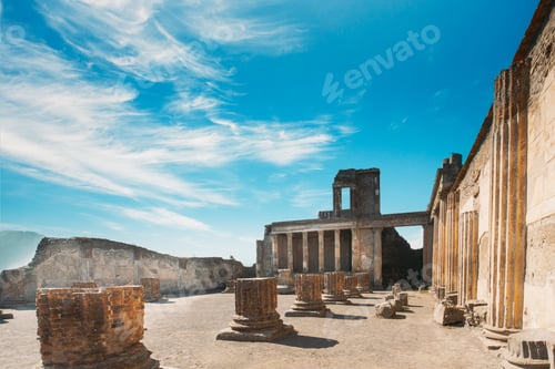 Preview: Pompeii, Italy. Young Woman Tourist Looking At Ancient Columns In Sunny Day