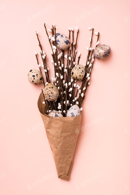 Preview: Happy Easter. Bouquet of quail eggs and pussy willow branches wrapped in brown paper