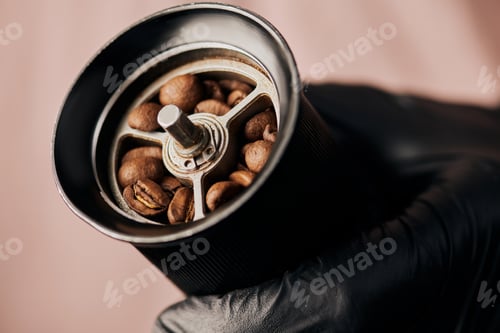 Preview: close up, barista holding manual coffee grinder with coffee beans, arabica, drink, blend, energy