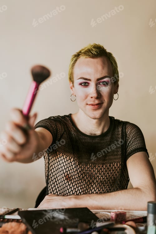 Preview: Non-binary beauty blogger with makeup tools