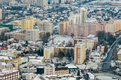 Preview: winter panoramic aerial view of a huge residential complex with high-rise buildings with snow
