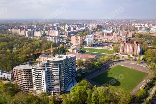 Preview: Apartment or office tall building under construction, top view. Drone aerial photography.