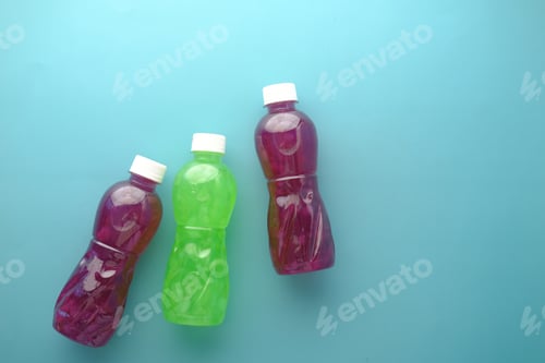 Preview: plastic bottles of soft drink on table