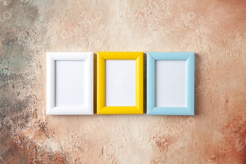 Preview: Front view of colorful three photo frames hung on mix color wall with free space