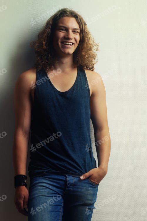 Preview: A little lighthearted laughter. Portrait of a handsome young man wearing a vest.