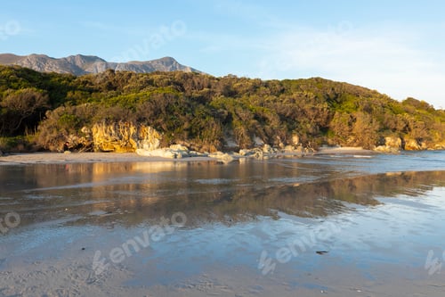 Preview: Woodland and mountains scenery, a small sheltered sandy beach on the Atlantic shore.