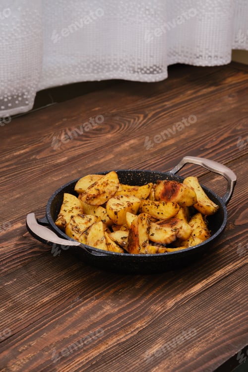 Preview: Baked potato wedges with spices, herbs and garlic